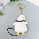 A keychain to the leatherette with carbine "Duckling squints" 10x7.6 cm