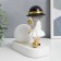 Souvenir Polystone Light "Baby in a black hat, with a gold bubble at the ball" 16.5x8x16 cm