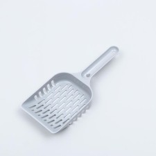 A scoop for cleaning a cat toilet, gray