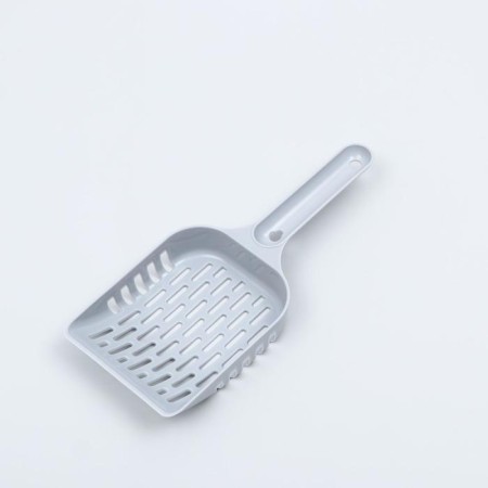 A scoop for cleaning a cat toilet, gray
