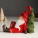 Souvenir Polystone Light "Santa Claus in a red outfit sits at the Christmas tree" 14x7x18 cm