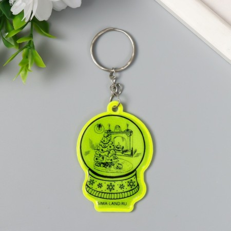 A keychain plastic reflective "snowball with a Christmas tree by the fireplace" 5.5x3.8 cm
