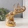 Souvenir Polystone "Elephant and 3 Elephants on the trunk. Indian patterns" Gold 19.8x10.3x21.5 cm