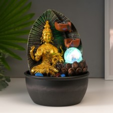 The desktop fountain from the Lakshmi network in gold robes near the waterfall 28x19x19 cm