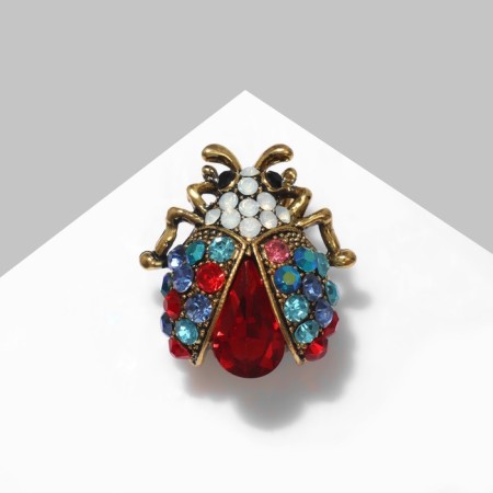 Brooch "Buke" is small, colored in black gold