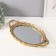 Standing interior polystone with a mirror "leaves" gold 23x41x5 cm