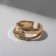 Ring "melting" double, white color in gold, dimensionless