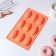 The form for baking the share "Easter. Chocolate egg ”, silicone, 9 cells, 28 × 16 × 2 cm, orange color