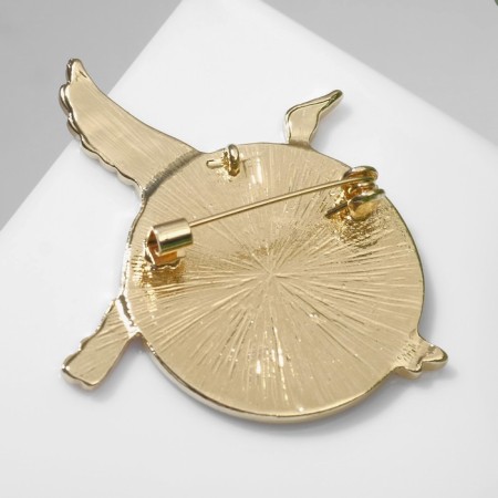 Brooch "Crane" soaring over the sea, colored in gold-1