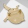 Brooch "Crane" soaring over the sea, colored in gold