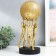Souvenir Polystone "Atlanta with a ball" gold 12.5x12.5x32 cm