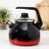 A kettle with a whistle "Carmen", 3 l, a fixed handle, induction, black-red color