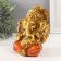 Souvenir Polystone for bronze "Ganesha, in orange haremasses" 10x10x12.5 cm