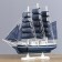 The ship souvenir medium "Kalev", the sides are blue with a white strip, the sails are blue, 30x7x32 cm