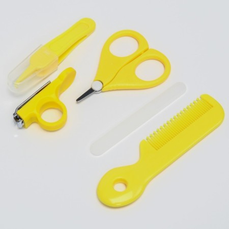 A child’s care set, 5 items (comb, tweezers, scissors, a knipser, saw), yellow color 6-3
