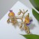 Brooch "Pomegranate Branch", colored pink-green in gold