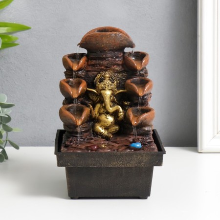 The desktop fountain from the Ganesh network at the cliff with a waterfall 18x12x12 cm