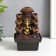 The desktop fountain from the Ganesh network at the cliff with a waterfall 18x12x12 cm