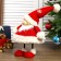 Interior doll "Grandfather Frost in red caftan and cap with snowflakes" 44x21x31 cm
