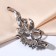 Brooch "Flower bow", white-blue color in silver
