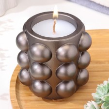 A candle in a candlelight made of gypsum with spherical faces, 10x10cm, gray-brown