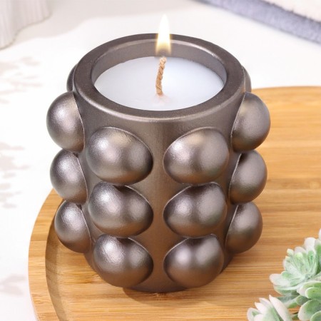 A candle in a candlelight made of gypsum with spherical faces, 10x10cm, gray-brown
