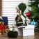 Interior doll "Girl with pigtails in a green coat and green hat" 36x8x13 cm