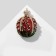 Brooch "Pomegranate" with a crown, black and white color in gold