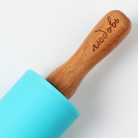 The rocking "Secret ingredient", 31 x 4 cm, silicone, wood, turquoise color-1