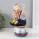 Souvenir Ceramics musical "Clown with butterfly and flower, sits on a cup" 9.5x10x18 cm