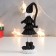 Polystone souvenir "High Santa Claus in black caftan, with a star" Long legs 15x5x4 cm