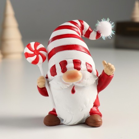 Polystone souvenir "Santa Claus in a white cap in red striped, with a candy" 9x6.5x10 cm