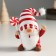 Polystone souvenir "Santa Claus in a white cap in red striped, with a candy" 9x6.5x10 cm