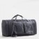 Road bag on a zipper, with an increase, 4 outer pockets, a long belt, the color is gray