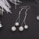 Hanging earrings with “Shambhala” rhinestones, white color in silver, 6.5 cm