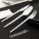 A set of plastic disposable cutlery 5 in 1: fork, spoon, knife, napkin, toothpick, white color