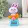 Plastic pendulum from the solar battery "White Bunny in the carrot machine" 5.8x6.5x10.5 cm