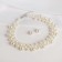 Set 2 objects: earrings, Kizel necklace scattering beads, white color, 42 cm