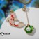 Emall Earms "Night" fish with a shell, the color is red-green in gold