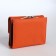 Women's wallet on the button, orange color