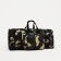 Road bag on a zipper, with an increase, 3 outer pockets, a long belt, camouflage color/brown