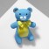 Icon "Bear" Plush in the Bange, the color of the yellow-blue in silver
