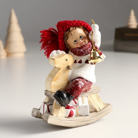 Polystone souvenir "Baby in a large red hat on a toy-rocking toy" 6x10x13 cm