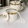 A set of ceramic cans with spoons on the “Watercolor” stand, 3 items: 220 ml, white color