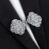 Cardigan clamp "Opener", white color in silver