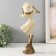 Polystone souvenir "Girl in a wide -brimmed hat. Wind" Sand with bronze 12.5x9.5x31 cm