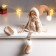 Interior doll "Baby with ponytails in a beige outfit" 62 cm