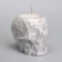 Candle "Skull" in a candlestick of gypsum with faces, 6x9x6.5cm, marble with black stripes