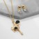 Set 2 objects: earrings, pendant “melting” Heart, black and white color in gold, 40 cm