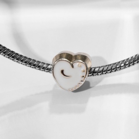 Talisman "Heart" with a pattern, white color in silver-1